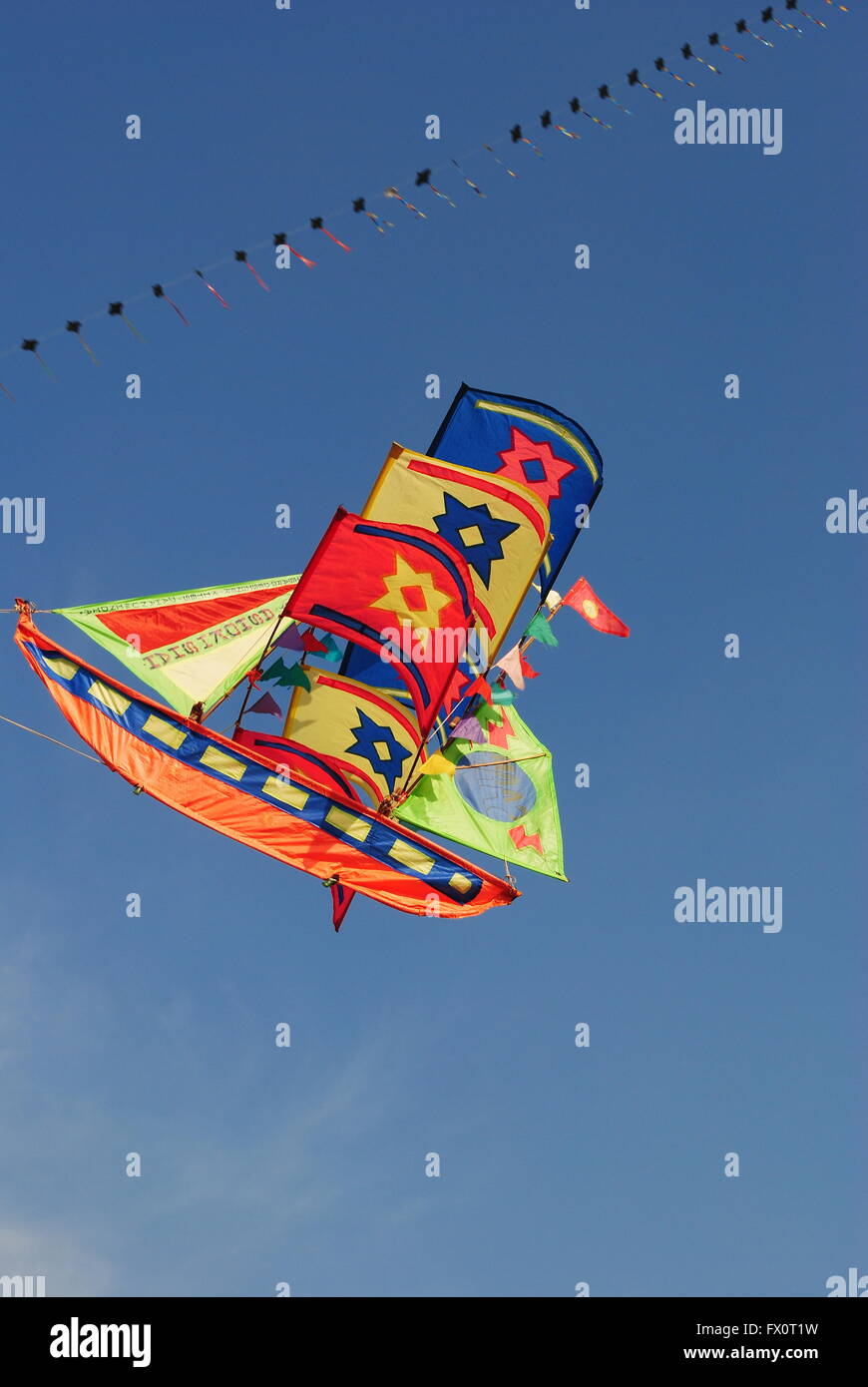 a bright and colourful ship shaped kite flying during the Kite Flying