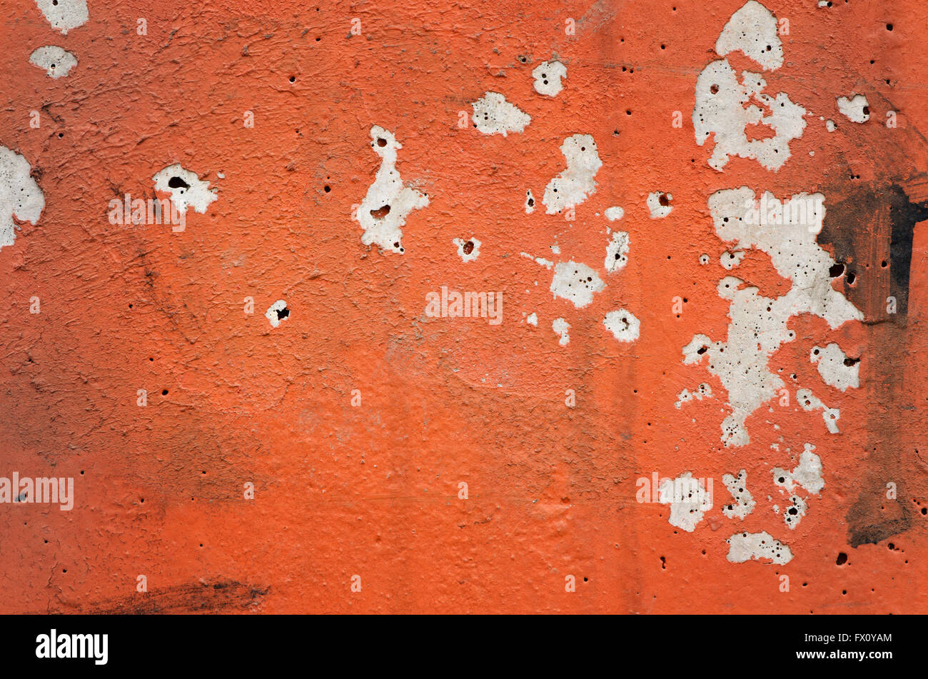 Orange black white painted chappy wall texture background. Stock Photo