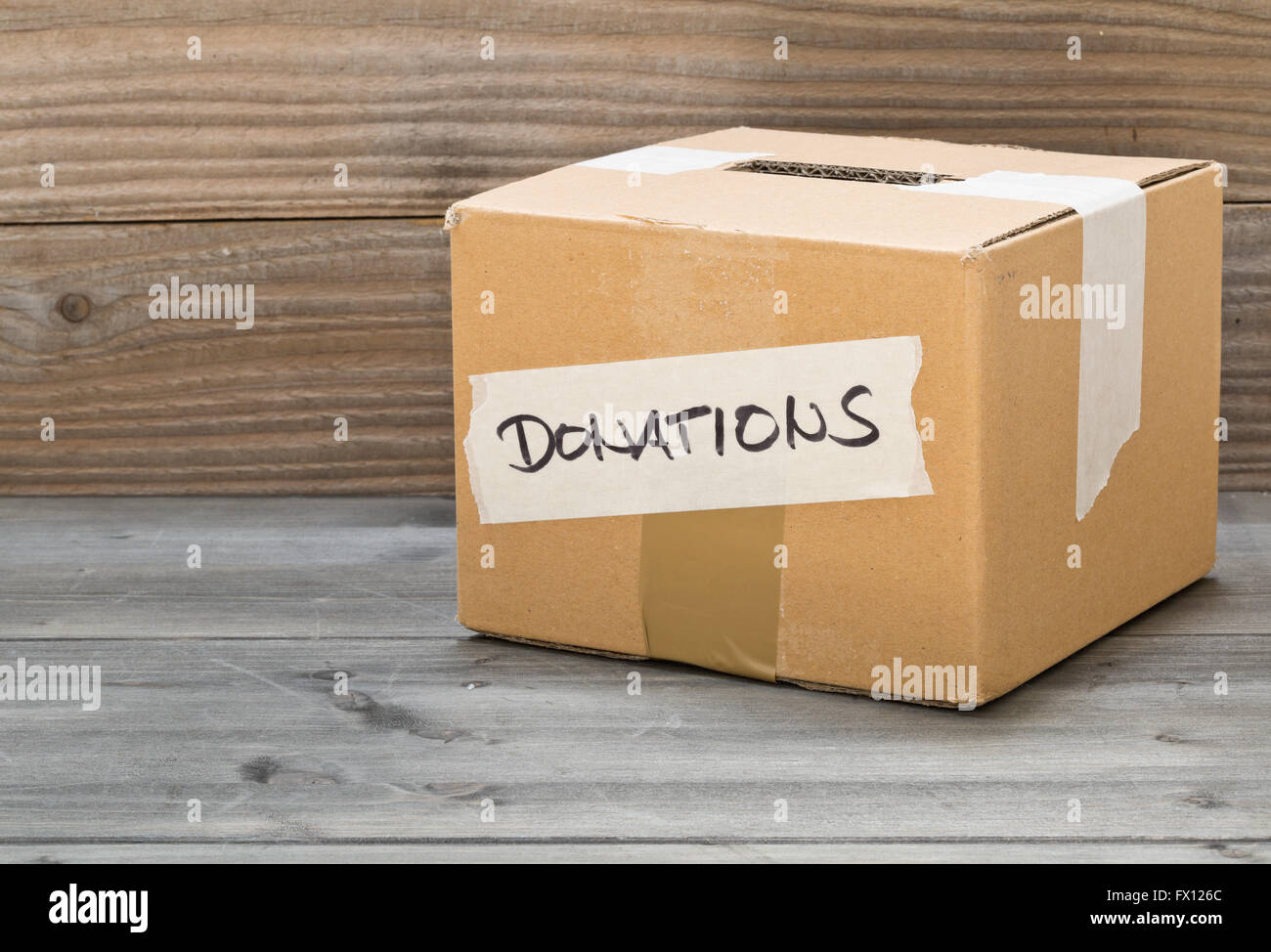 Cardboard Donations Box With Text On Wooden Table Stock Photo - Alamy