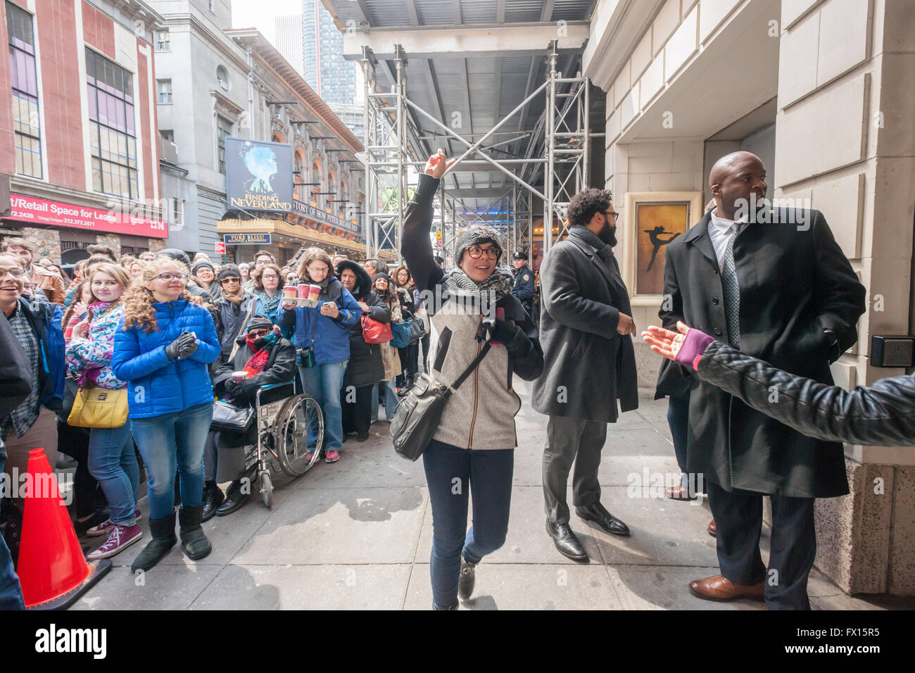A winner comes forward at the Richard Rodgers Theatre in Times Square in New York on Wednesday, April 6, 2016 after her name is called for tickets in the #Ham4Ham lottery for seats for the Broadway blockbuster 'Hamilton'. The $10 live lottery takes place in front of the theater for the Wednesday matinee performance while for the rest of the week's performances the lottery is online. (© Richard B. Levine) Stock Photo