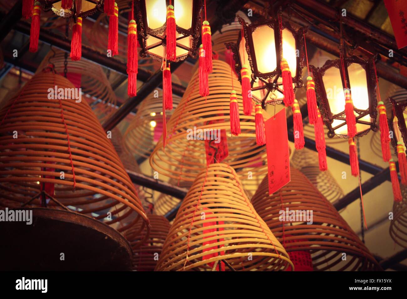 Large incense coils hanging from the ceiling of the Man Mo Temple, Hong  Kong Stock Photo - Alamy