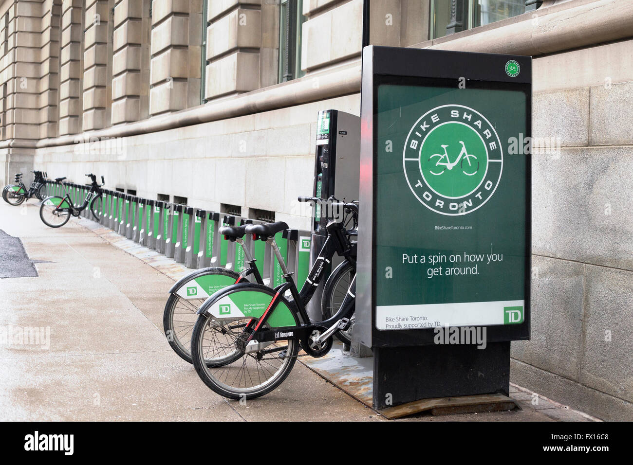 Bicycle share rental station outside office building in downtown Toronto Stock Photo