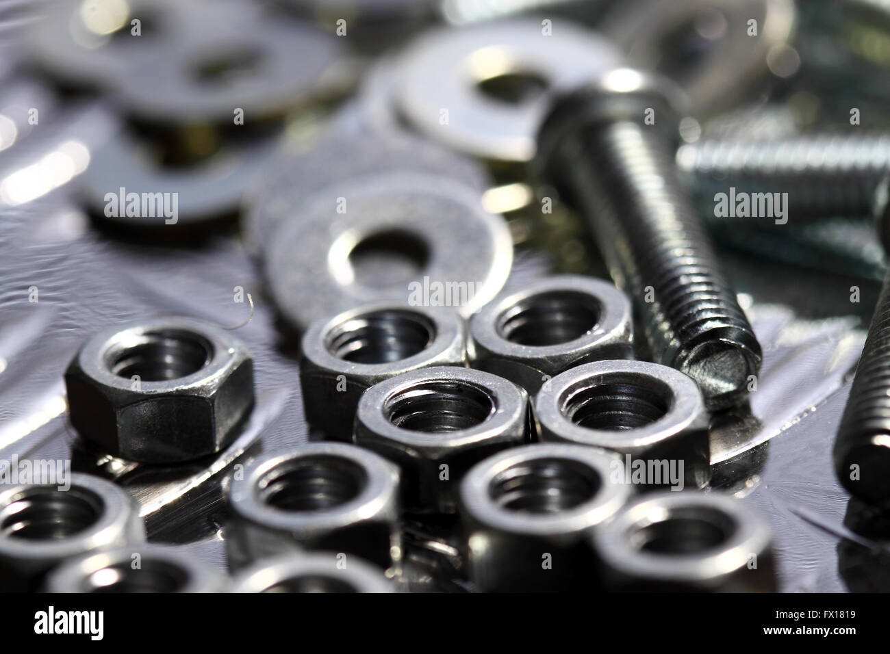 nuts bolts washers steel background Stock Photo