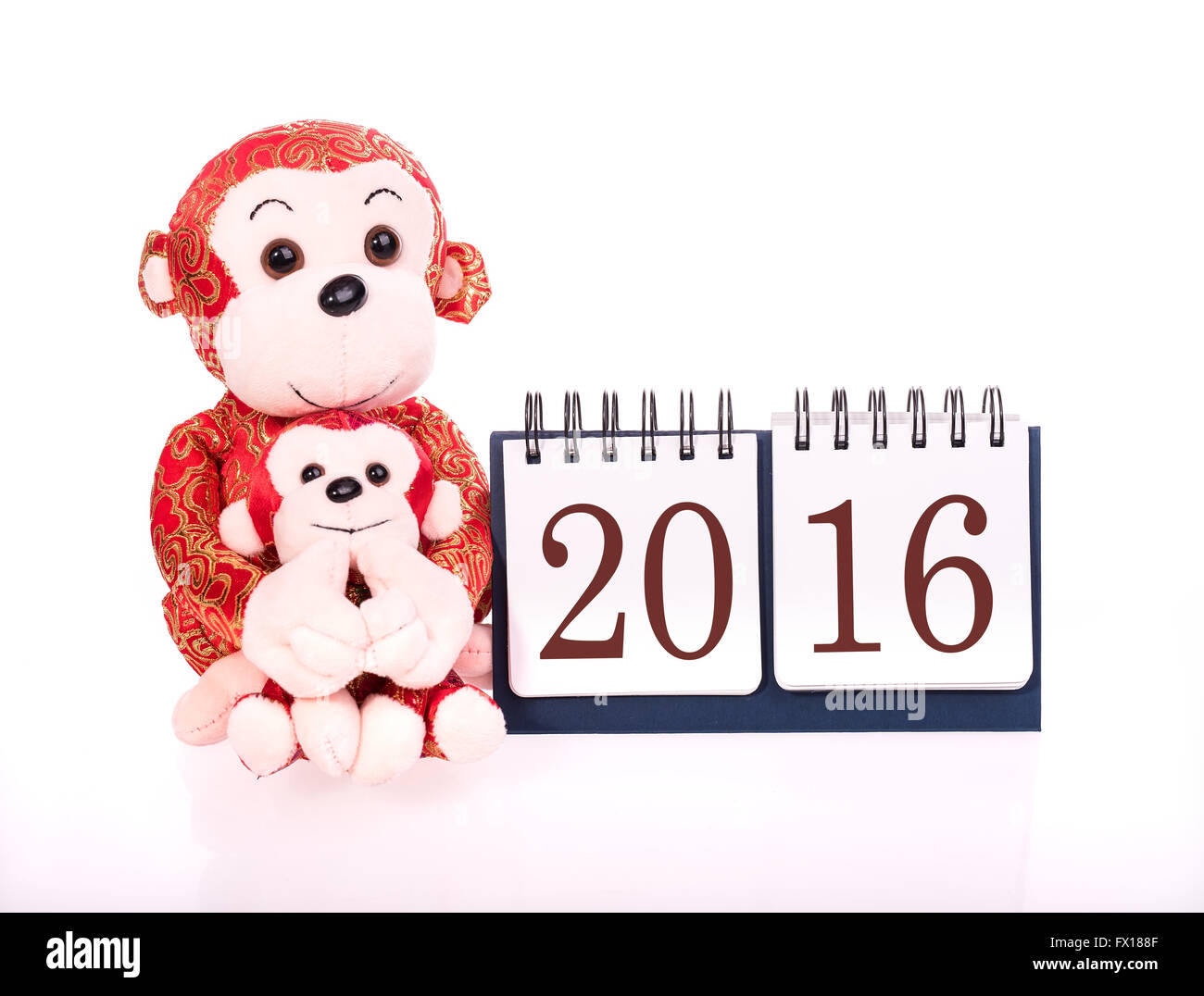 Chinese lunar new year ornaments toy of monkey on festive background Stock Photo