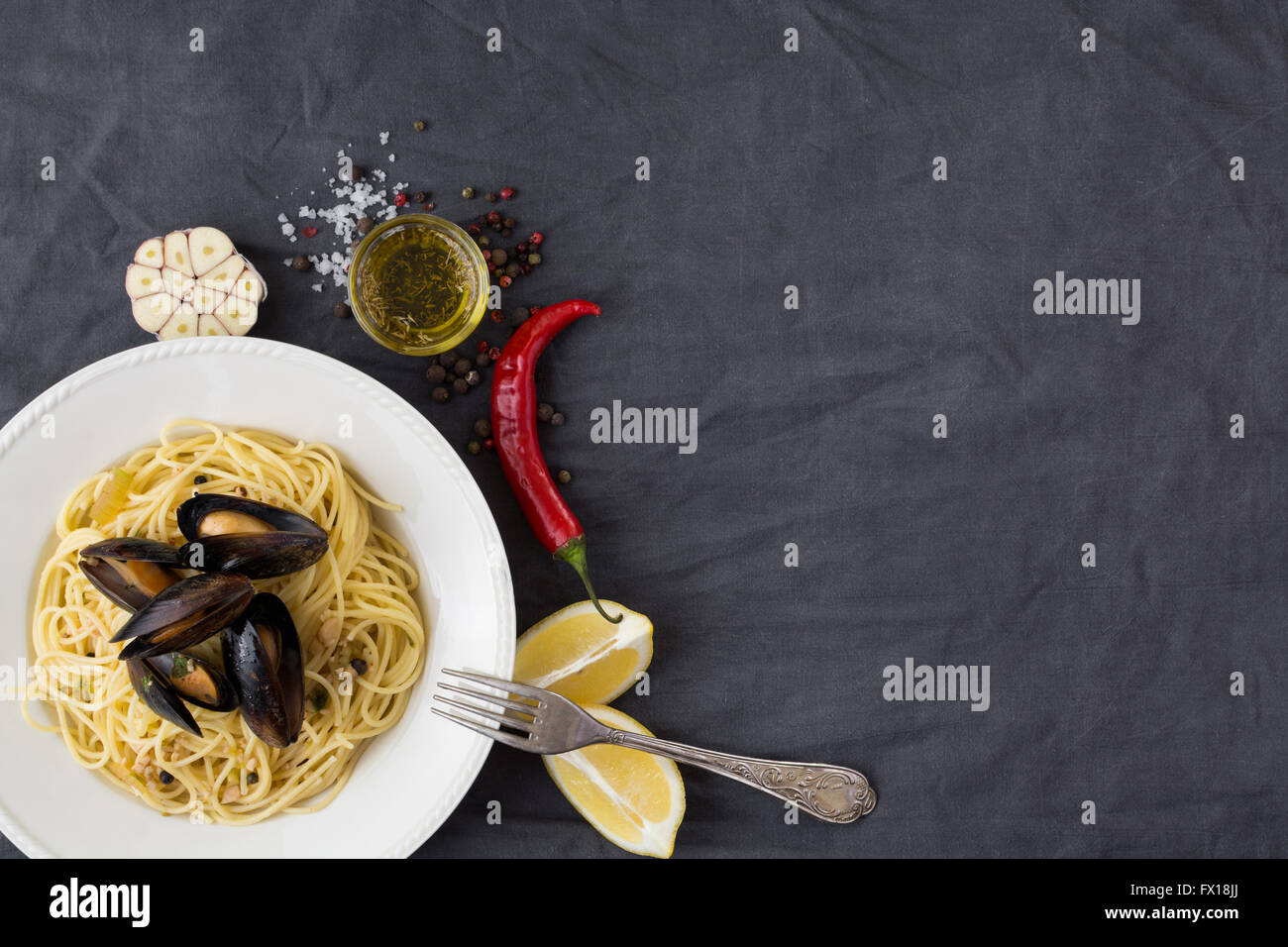 Pasta with mussels, lemons, chili pepper and spices Stock Photo Alamy