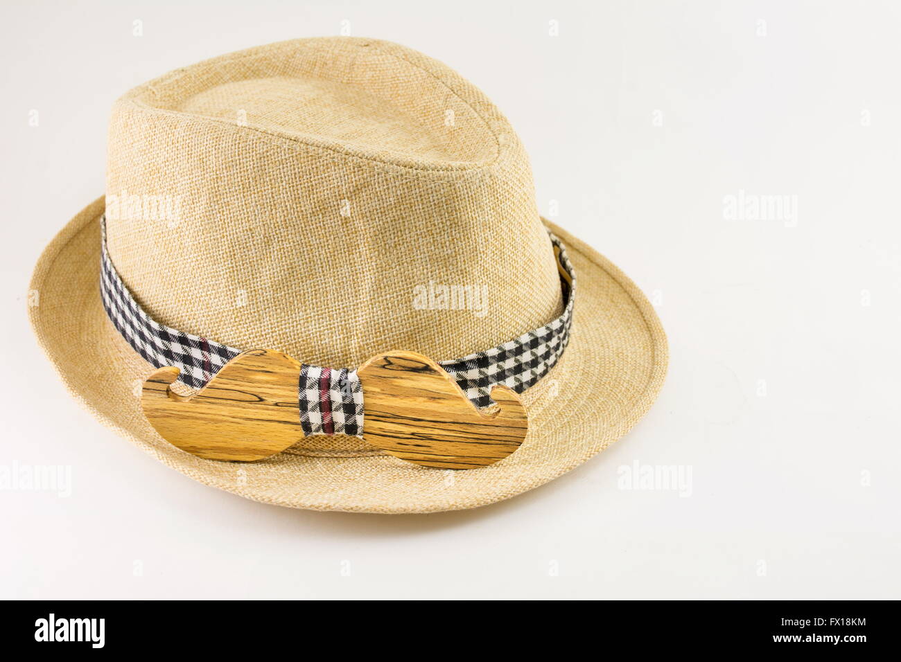 Wooden bow tie around a hat. Man accessories Stock Photo
