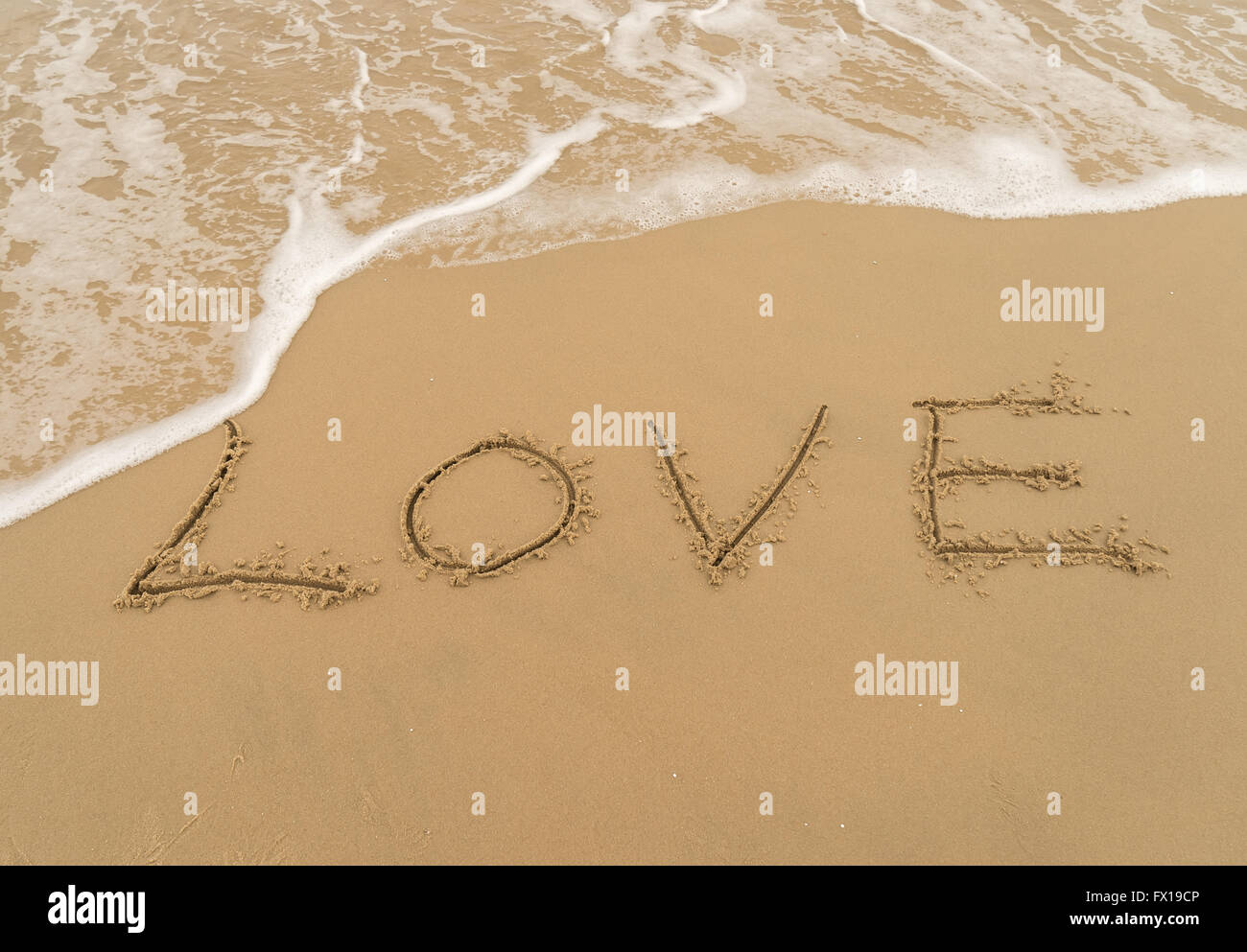 Love write in the sand Stock Photo