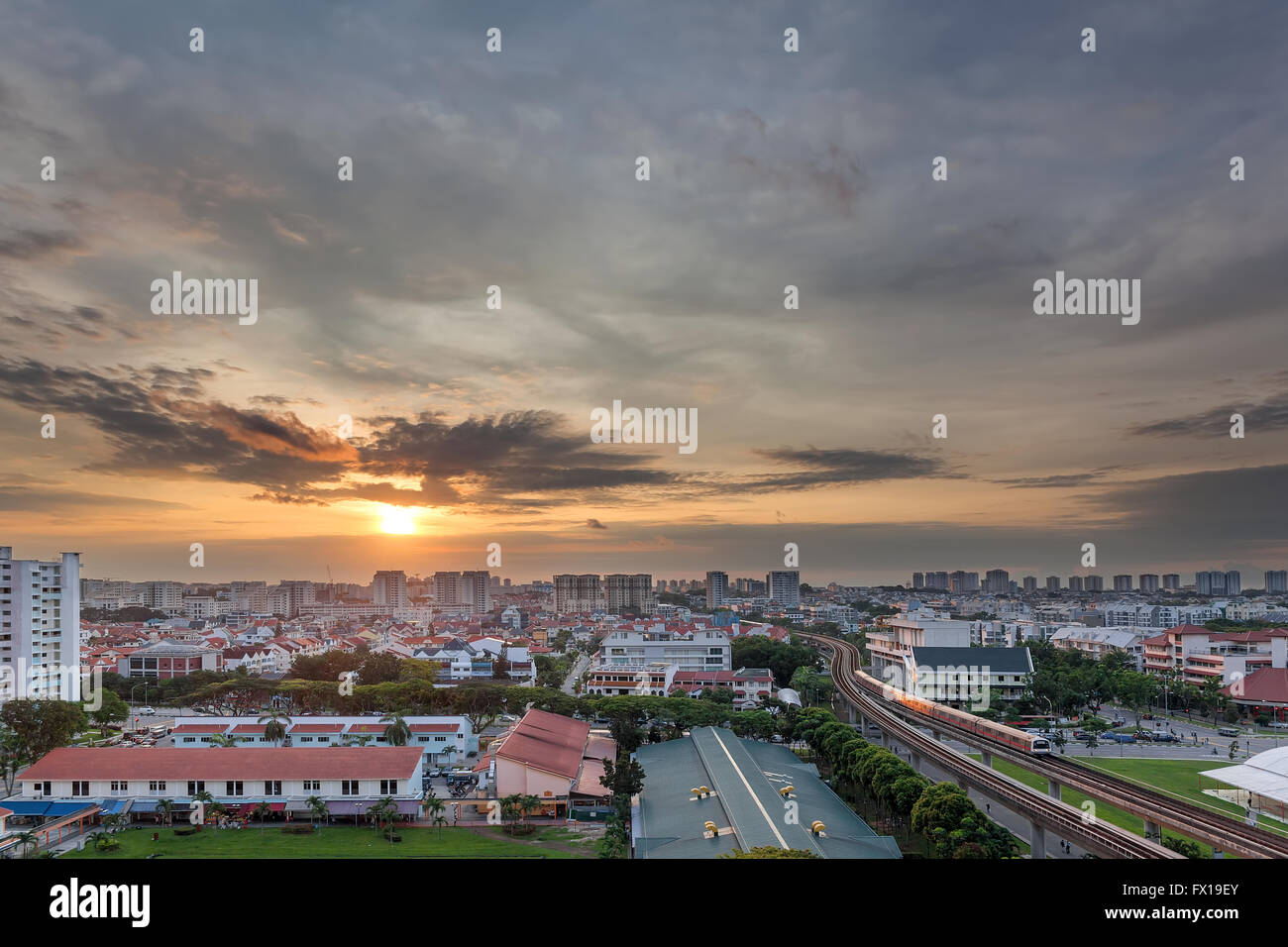 Sunrise over Eunos residential area by MRT train station in Singapore Stock Photo