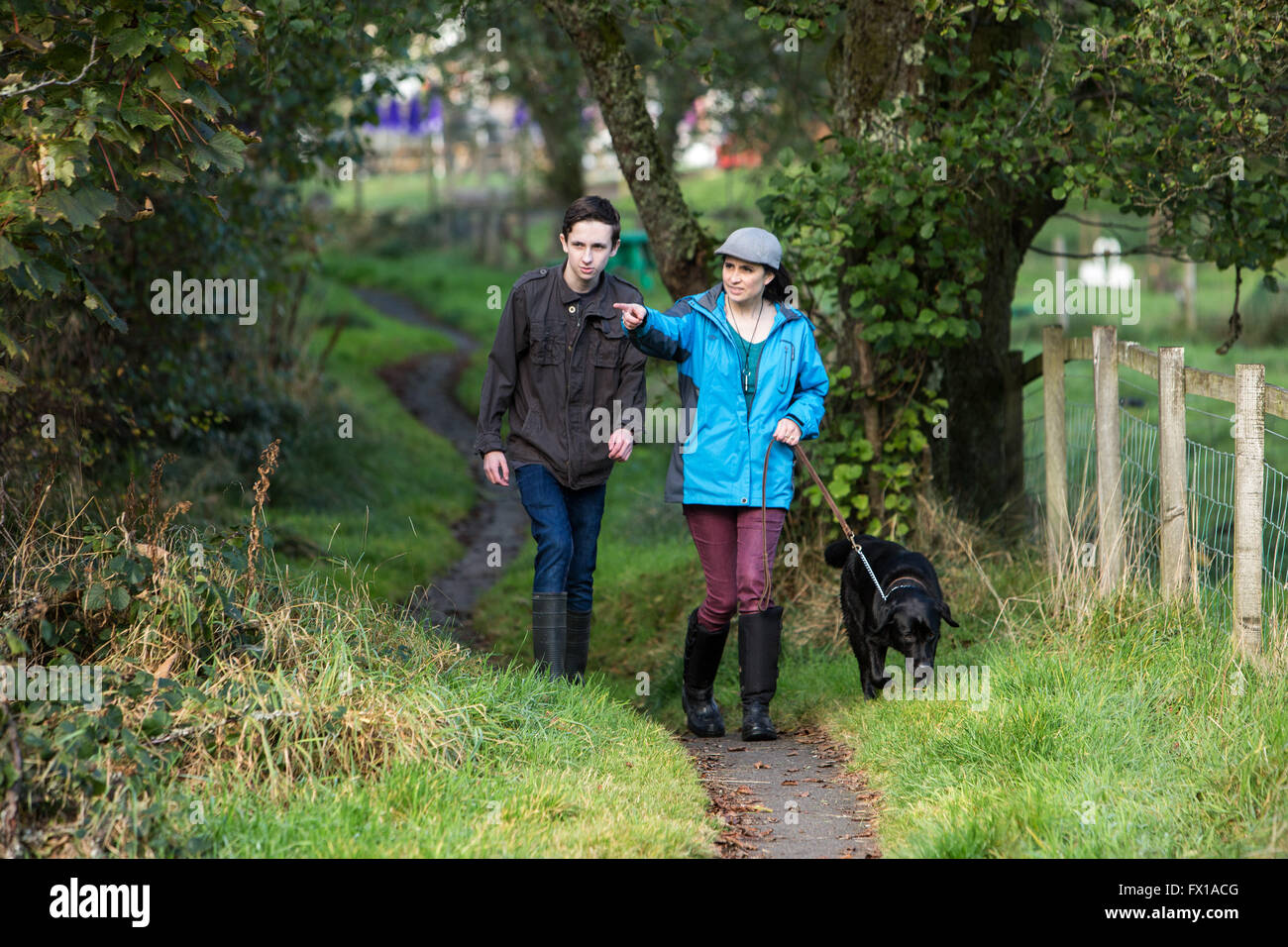 Mother and son walking dog Aberfoyle Scotland Stock Photo