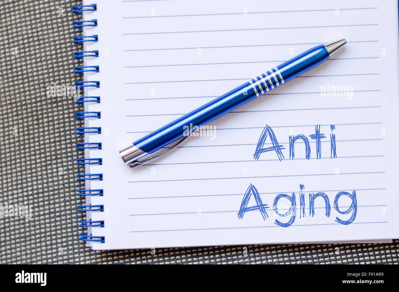 Anti aging text concept write on notebook Stock Photo