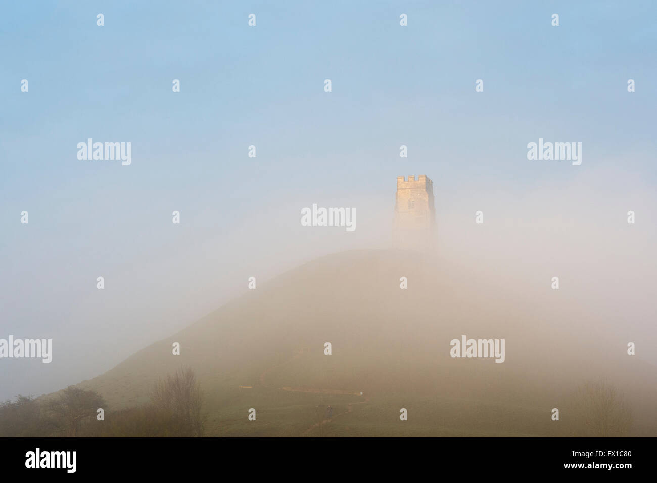 Glastonbury Tor covered in mist at sunrise. Glastonbury, Somerset, England Stock Photo