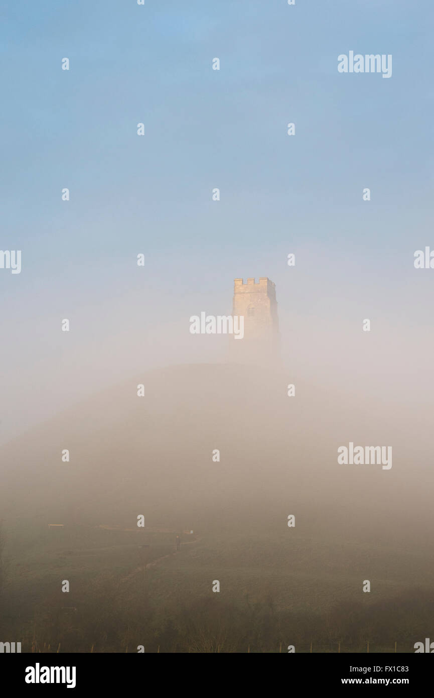 Glastonbury Tor covered in mist at sunrise. Glastonbury, Somerset, England Stock Photo