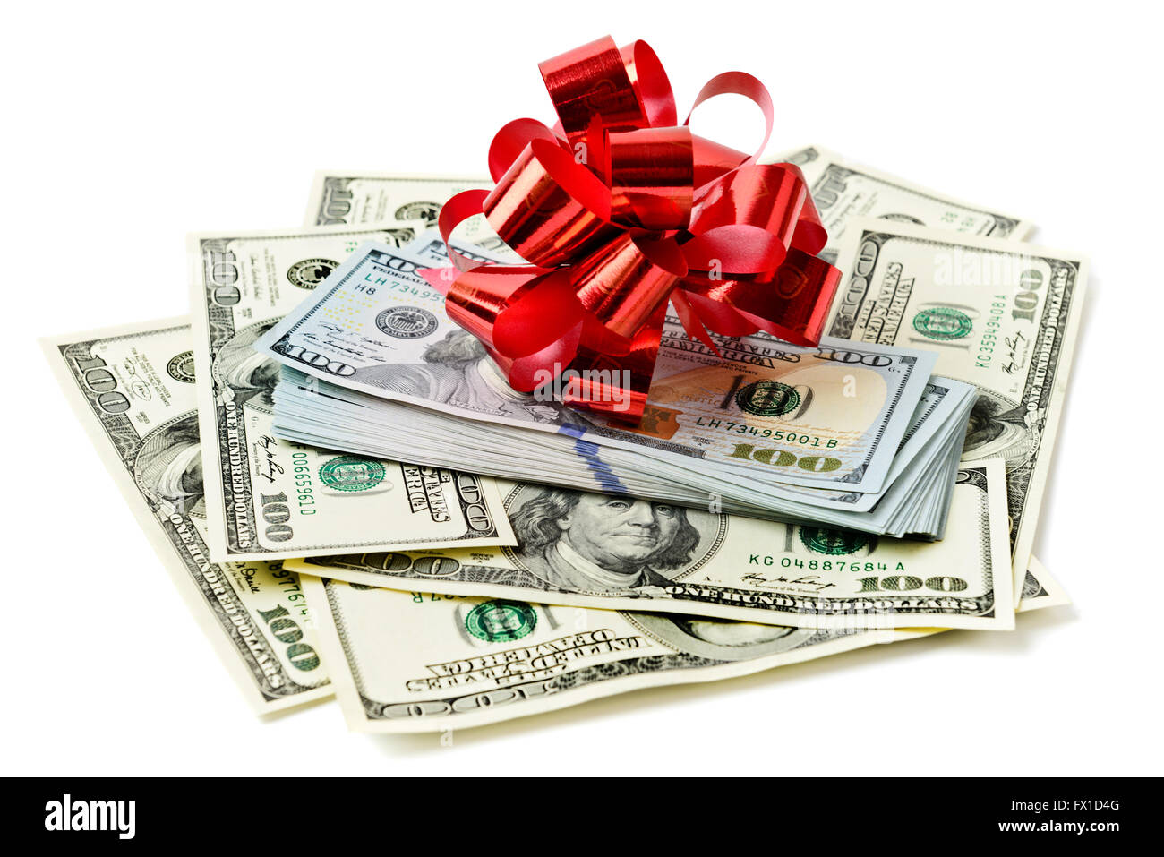 Roll stack of cash with red bow on banknotes  isolated. Money gift Stock Photo