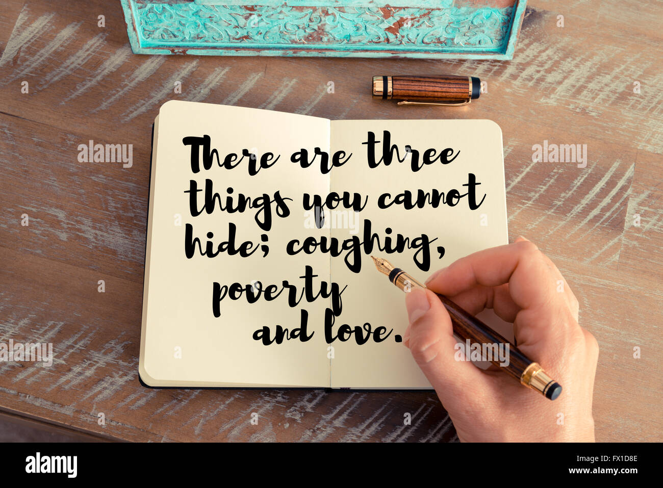 Retro effect and toned image of a woman hand writing on a notebook.  Handwritten quote There, image size:1300x957