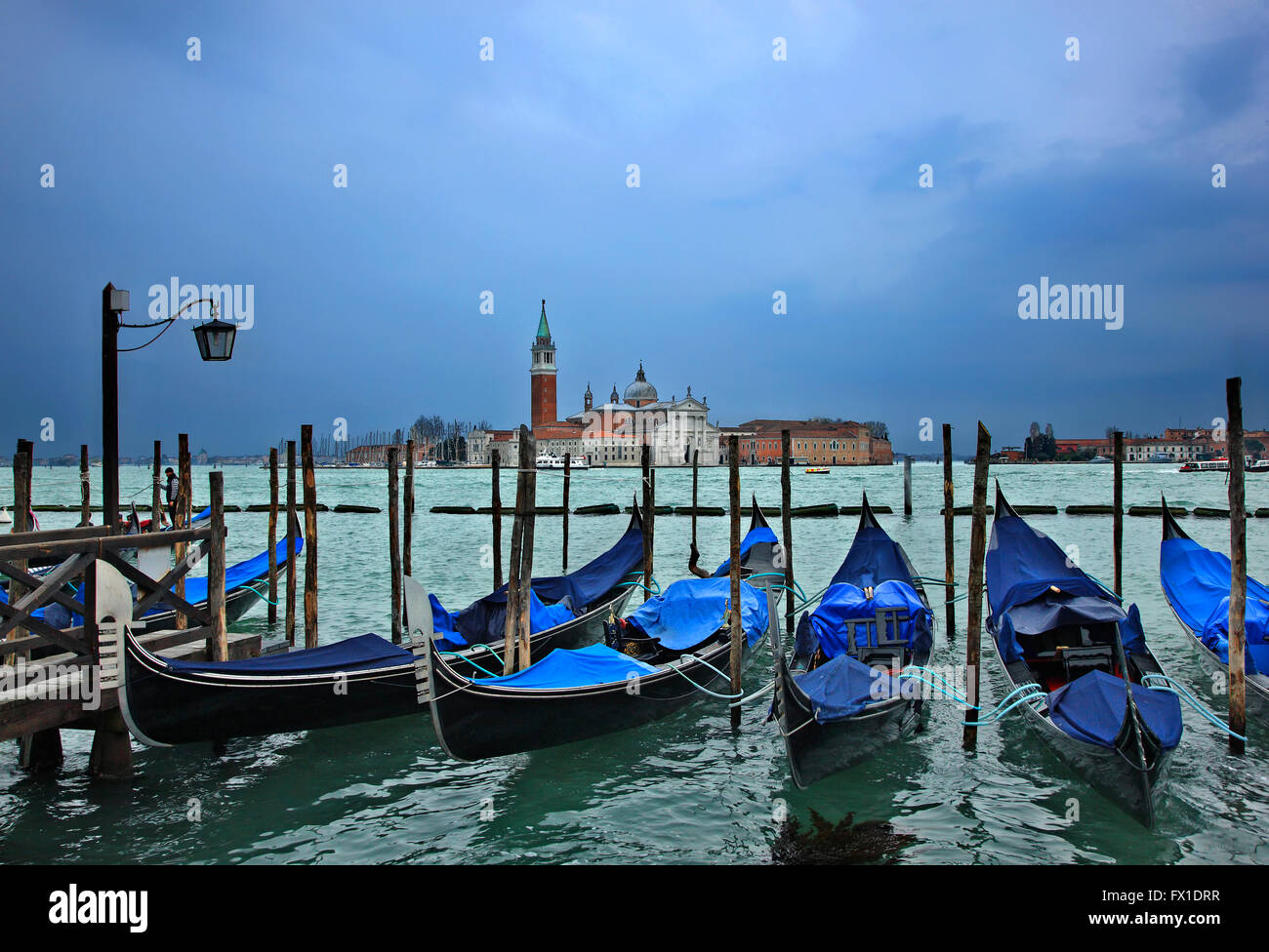 Gondolas in front of San Marco square, Venice, Italy. In the background, San Giorgio Maggiore. Stock Photo