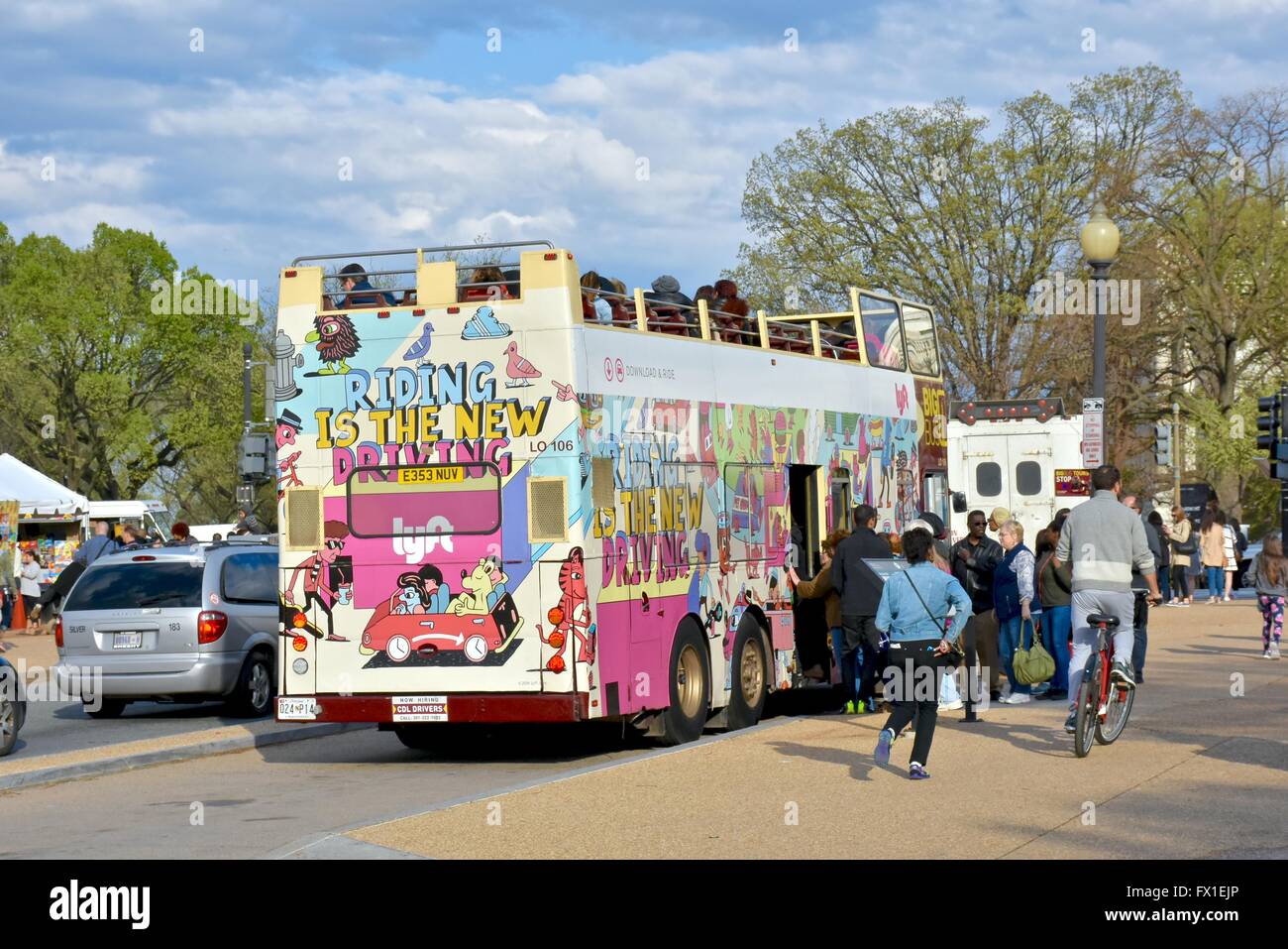 Tourists getting onto a tour bus in Washington DC. Stock Photo