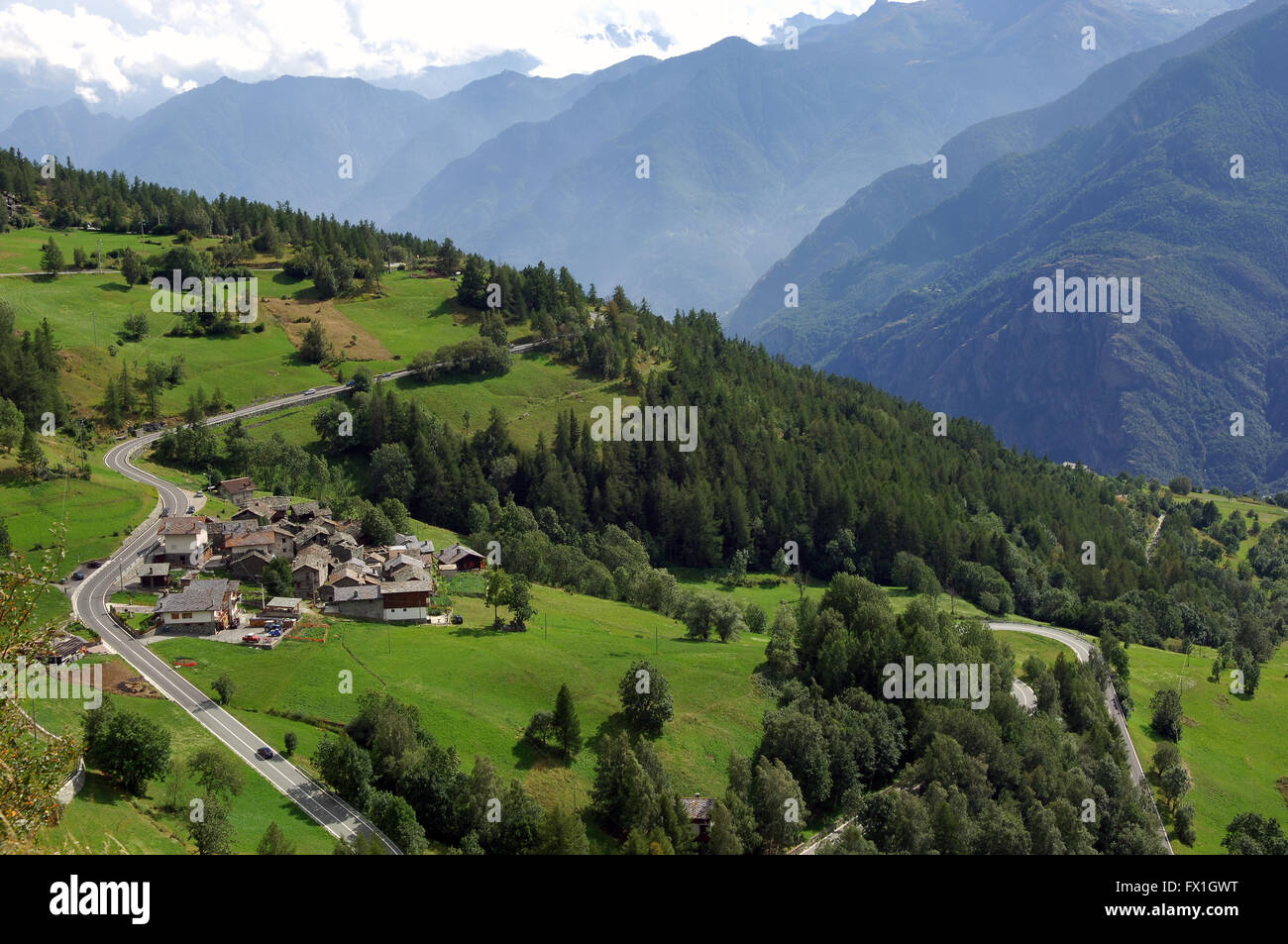 group of houses along a road in a slope of the Valle d'Aosta Stock
