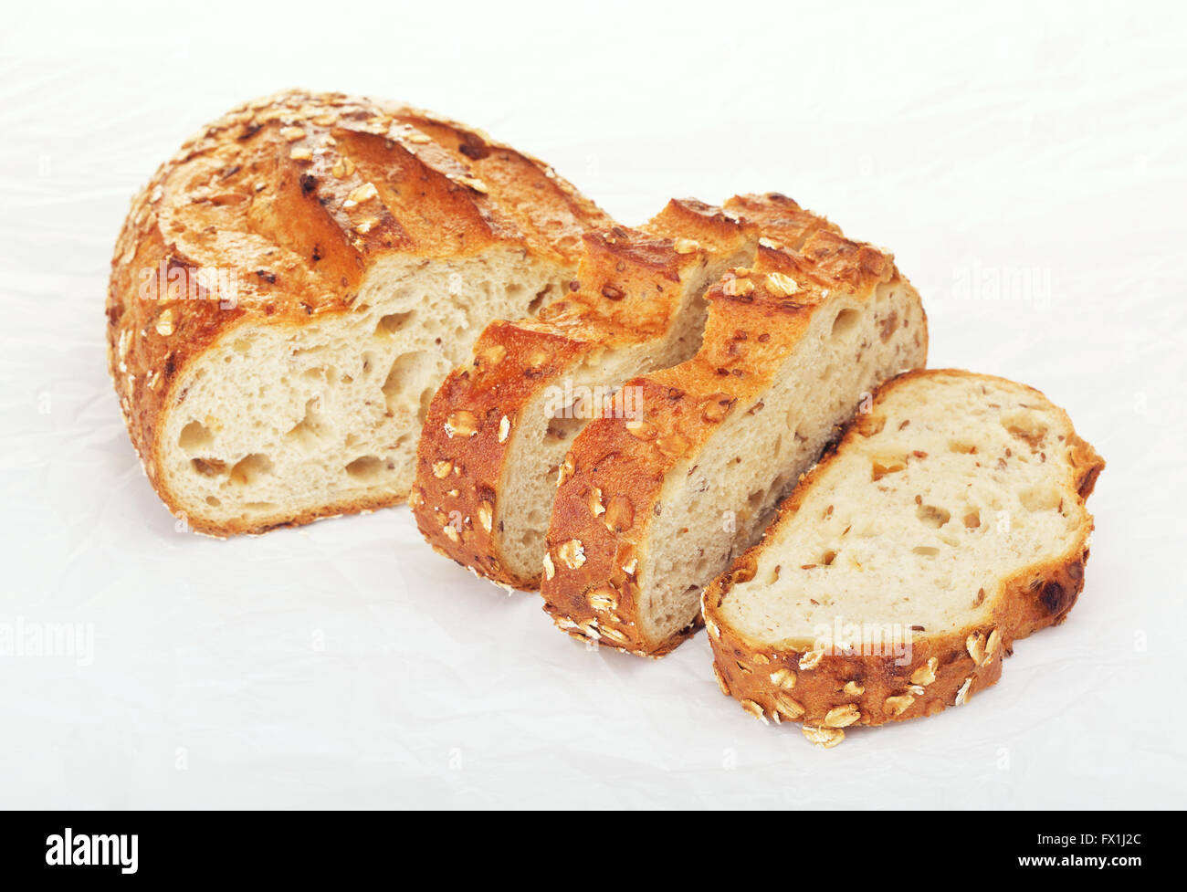 sliced wholegrain bread with oats and nuts, on paper Stock Photo Alamy