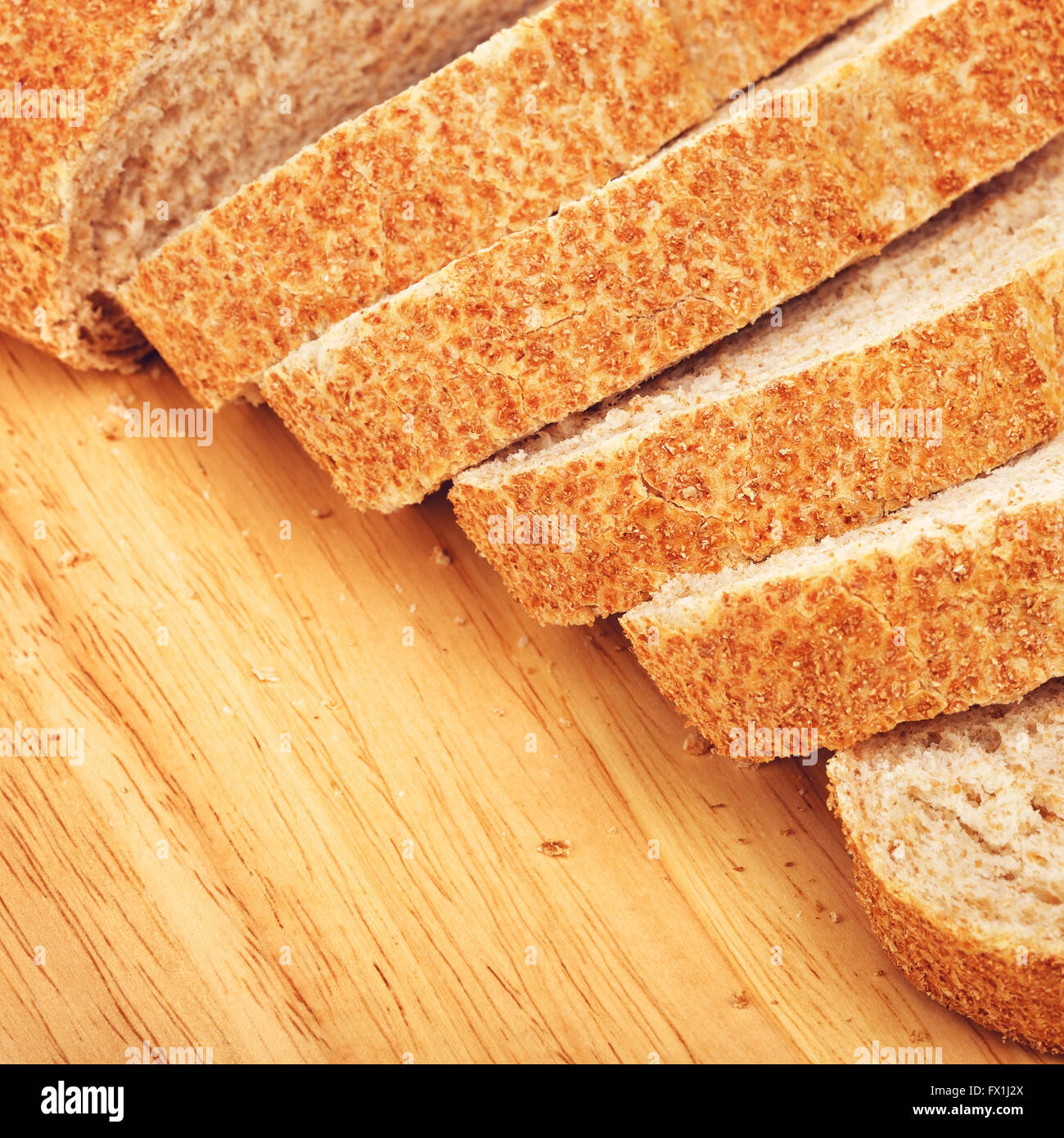 sliced wholegrain white bread lying on cutting board Stock Photo - Alamy