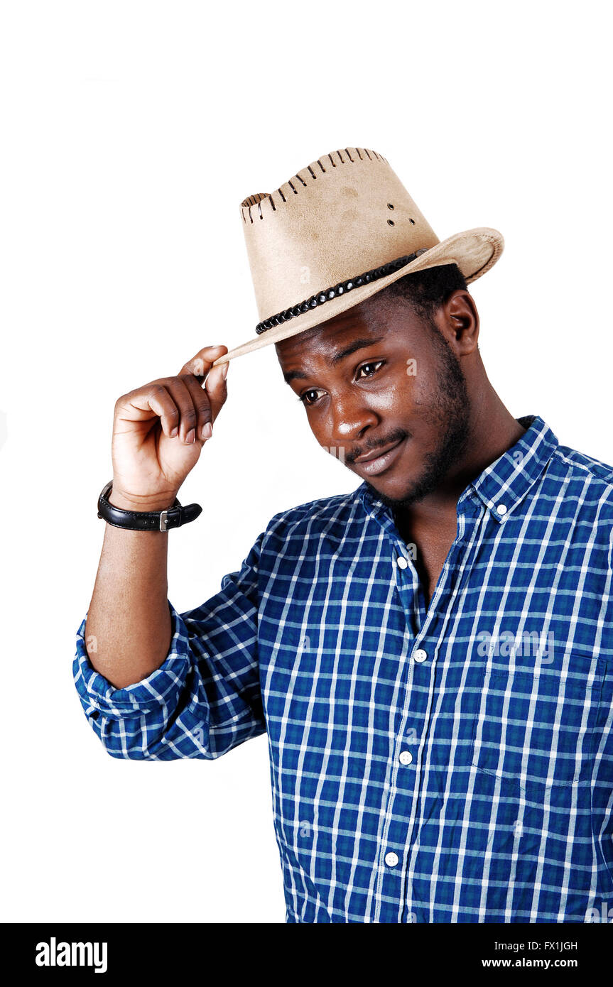 A smiling young black man in a blue shirt and an cowboy hat on his head