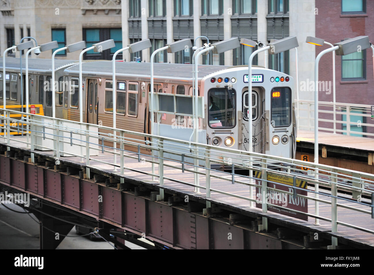 A CTA Green Line rapid transit train pulling into the Randolph Street