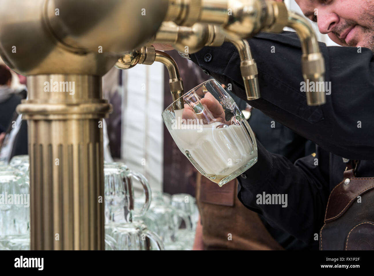 bartender pouring so called Mliko (type of beer pouring) during Pilsner