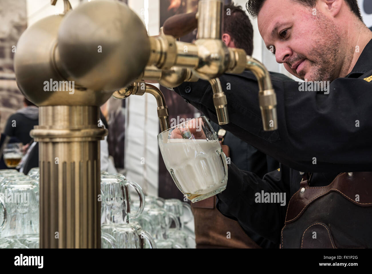 bartender pouring so called Mliko (type of beer pouring) during Pilsner