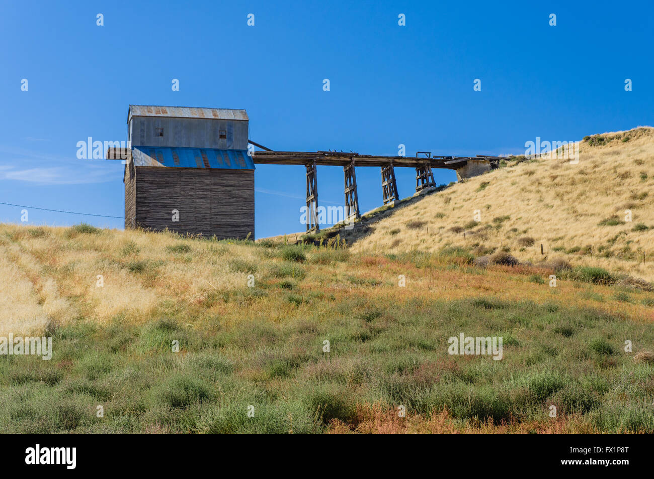 Agricultural building with second floor access ramp on a farm in Eastern Washington Stock Photo