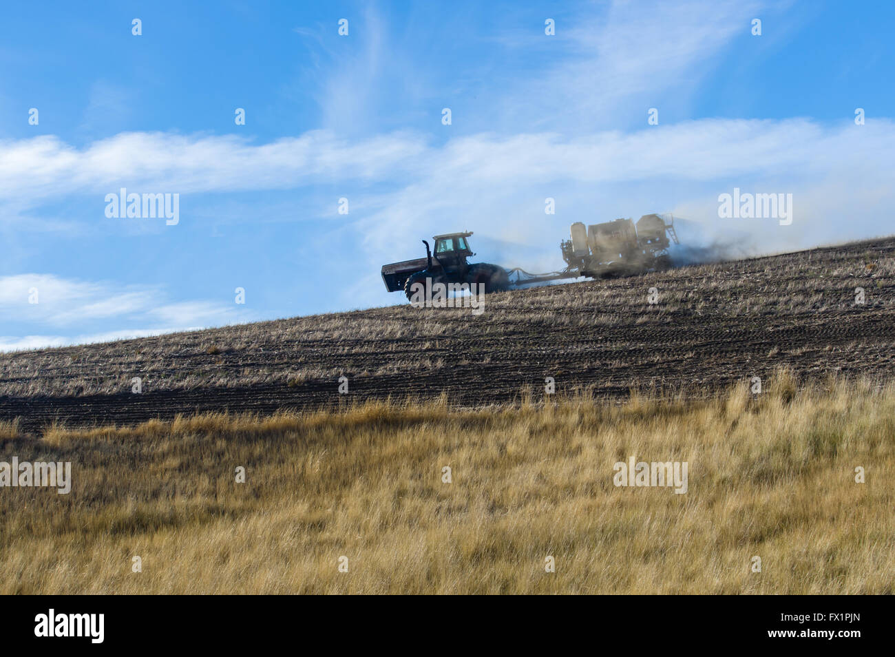 Tractor pulling a planter and sprayer on a farm in eastern Washington.  Saint John, Washington Stock Photo