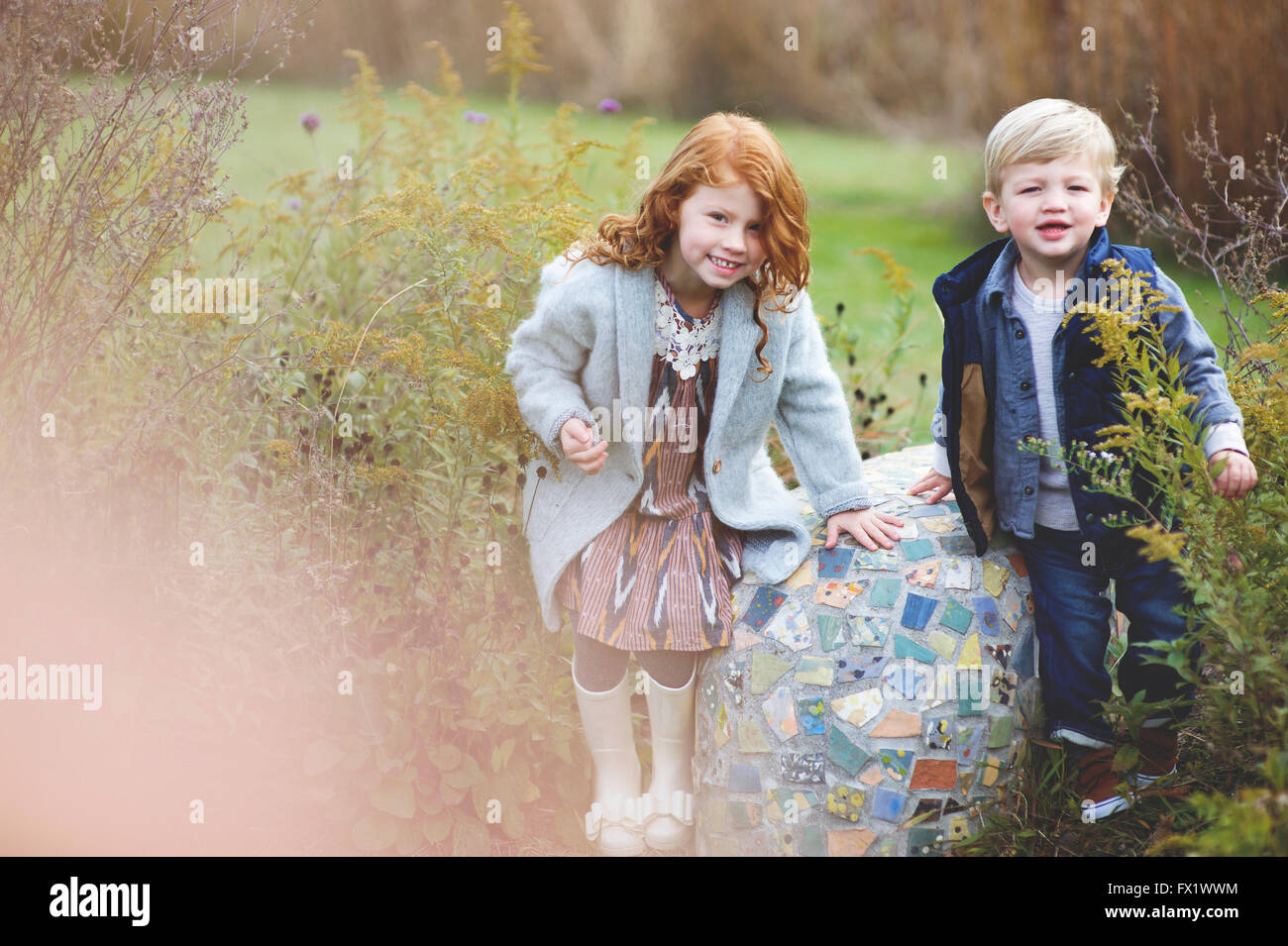 Family pictures of brother and sister at the park Stock Photo - Alamy