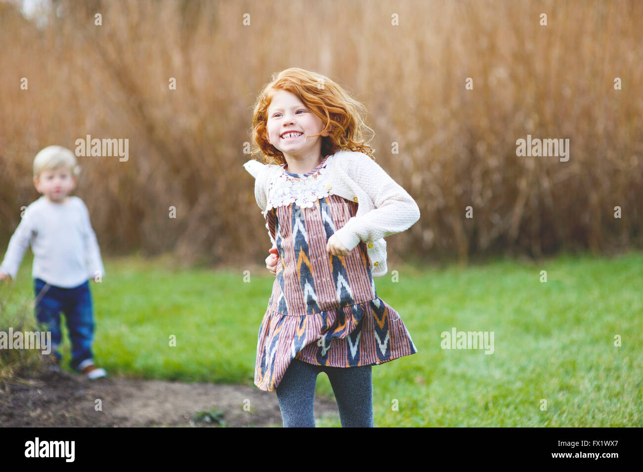Family pictures of brother and sister at the park Stock Photo - Alamy
