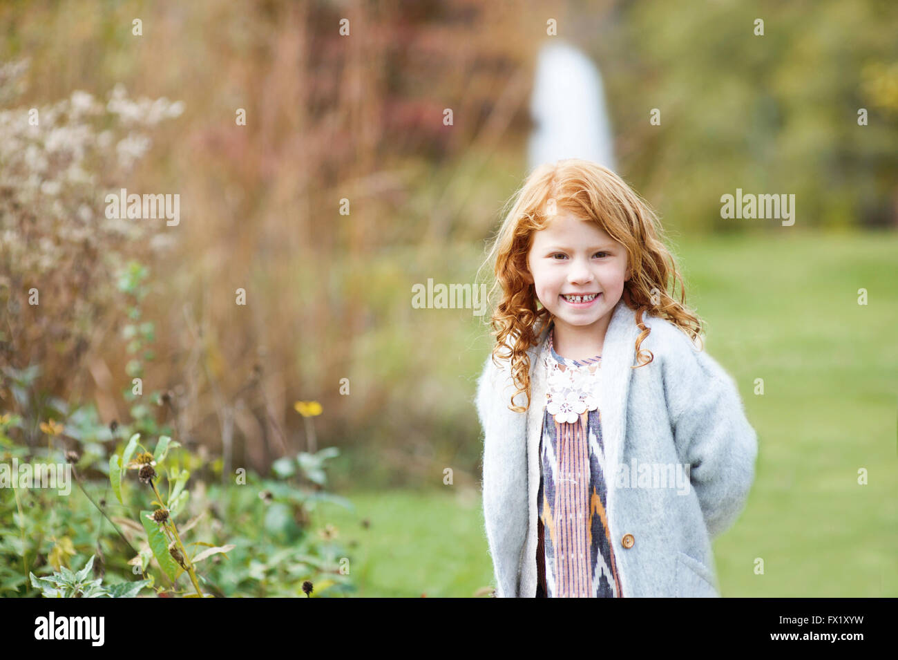 Portrait of a girl in a park Stock Photo - Alamy