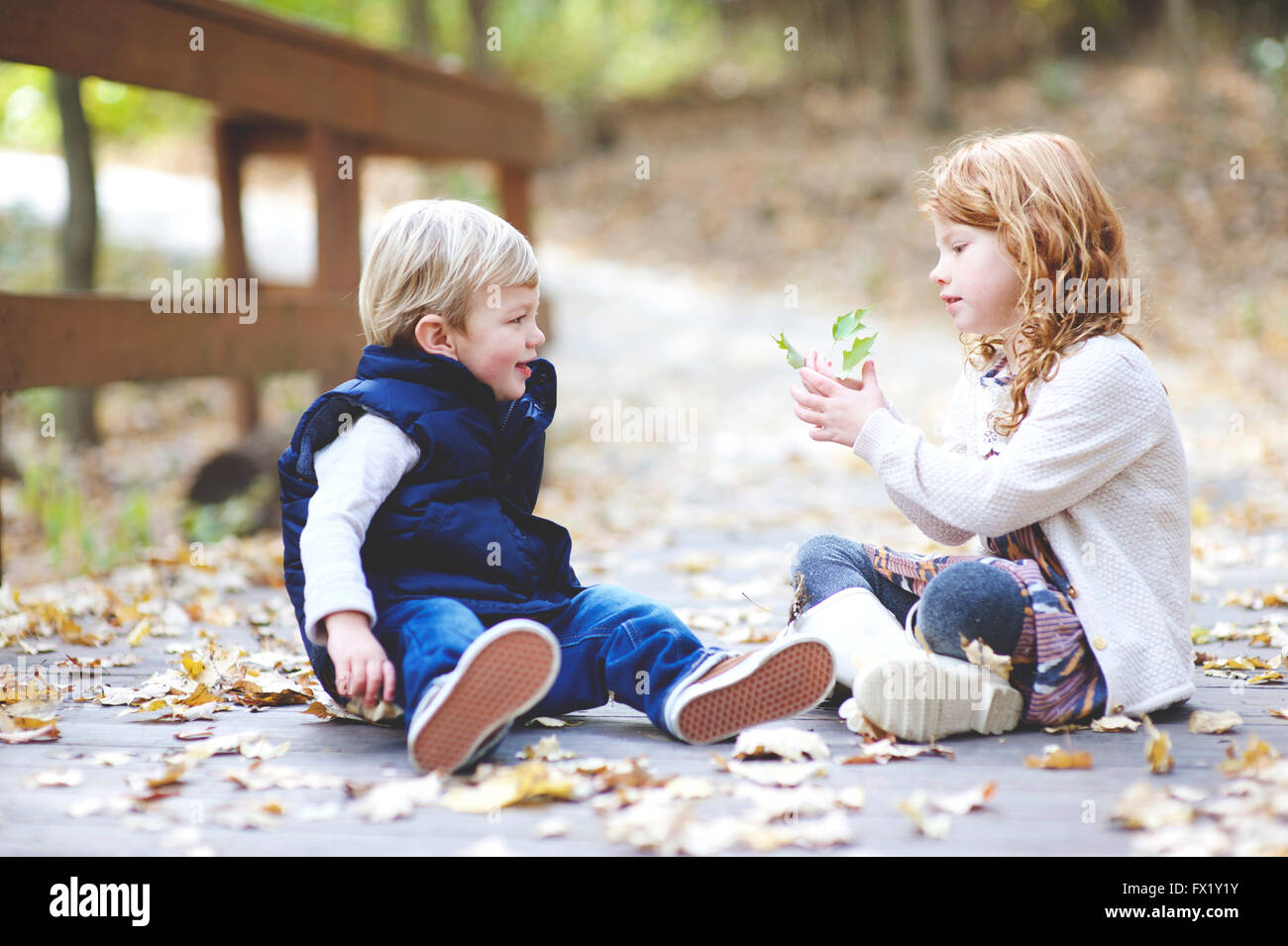 Family pictures of brother and sister at the park Stock Photo - Alamy