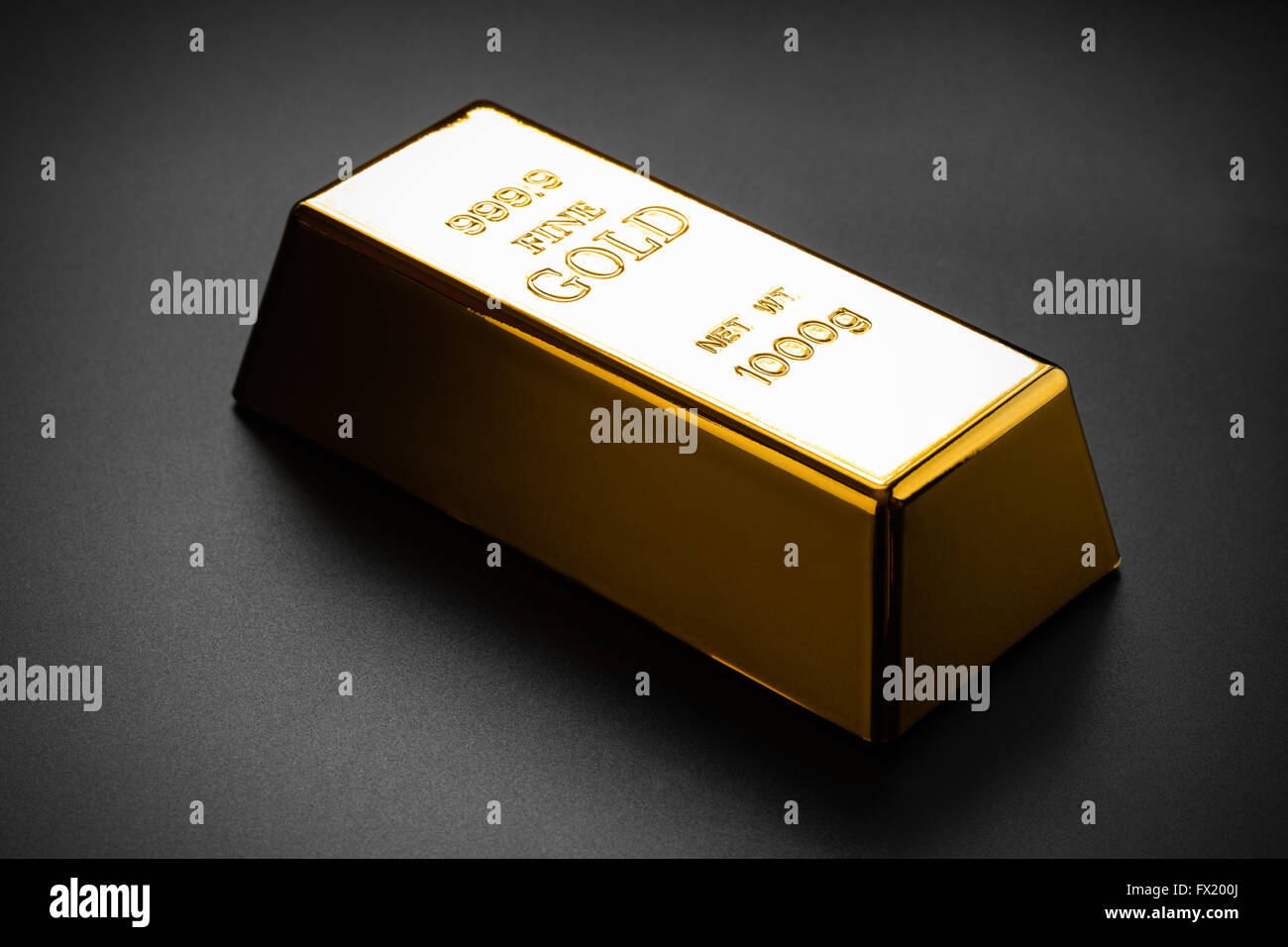 closeup of gold bullion on a dark background Stock Photo
