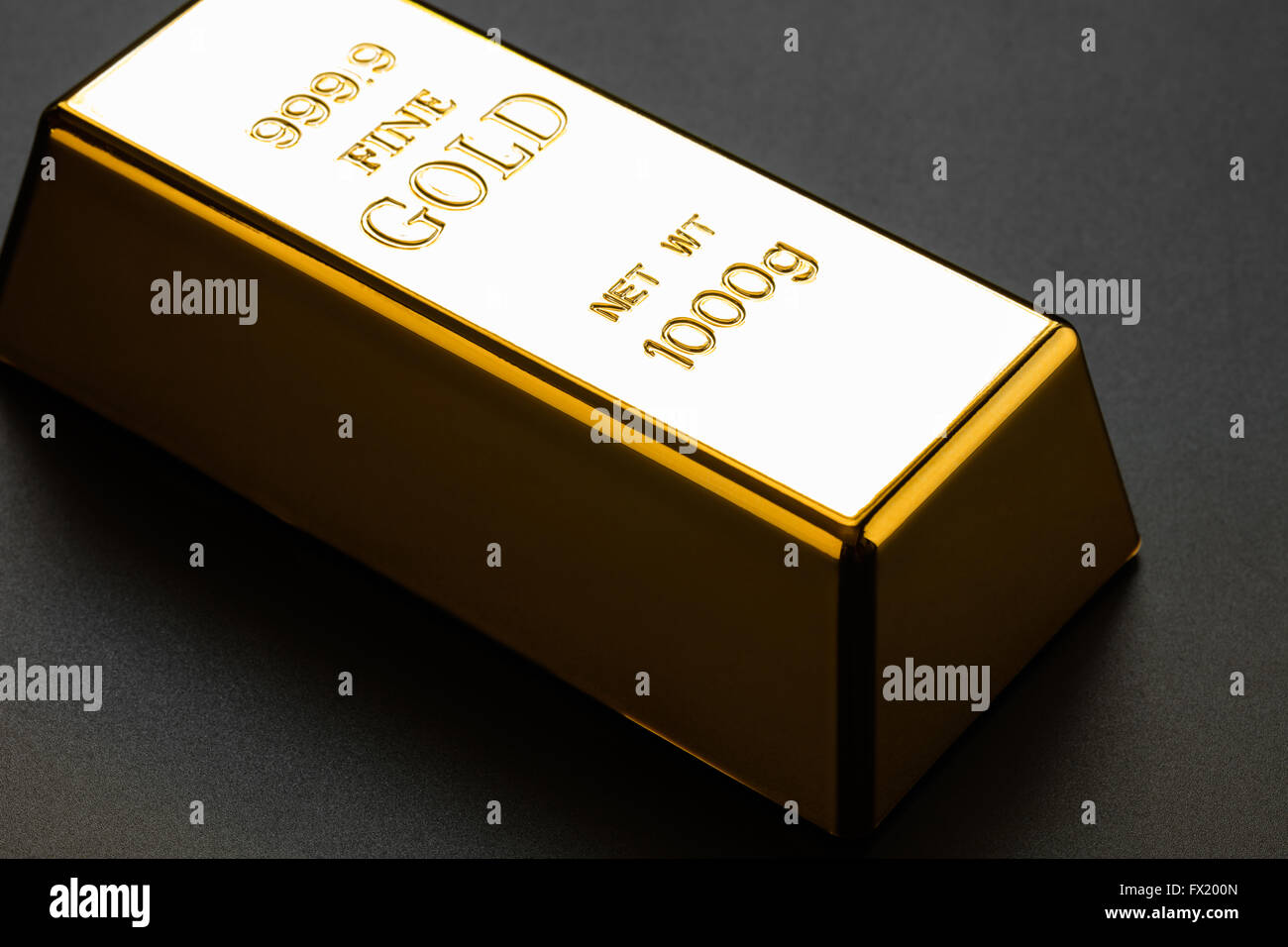 closeup of gold bullion on a dark background Stock Photo