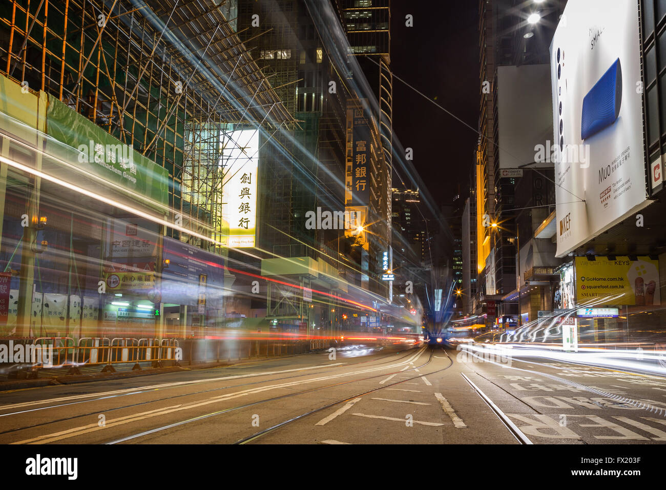 Light trails of tram and cars in Hong Central, Kong, China, at night. Stock Photo