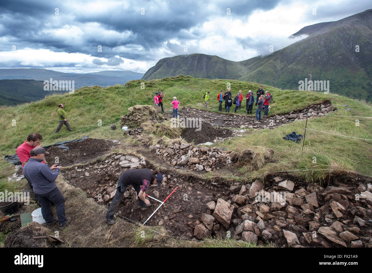 Archaeological Dig on Dun Deardail.with Ben Nevis in background Stock Photo