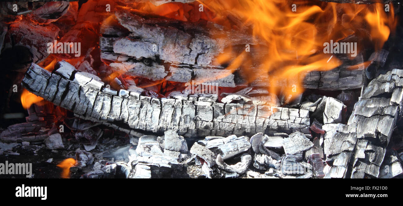 Fire on hot live charcoal extreme closeup photo Stock Photo