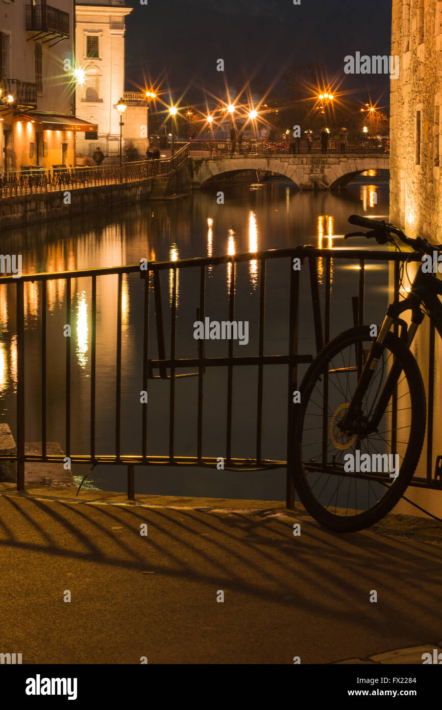 A bicyle at night in Annecy Le Vieux France Stock Photo