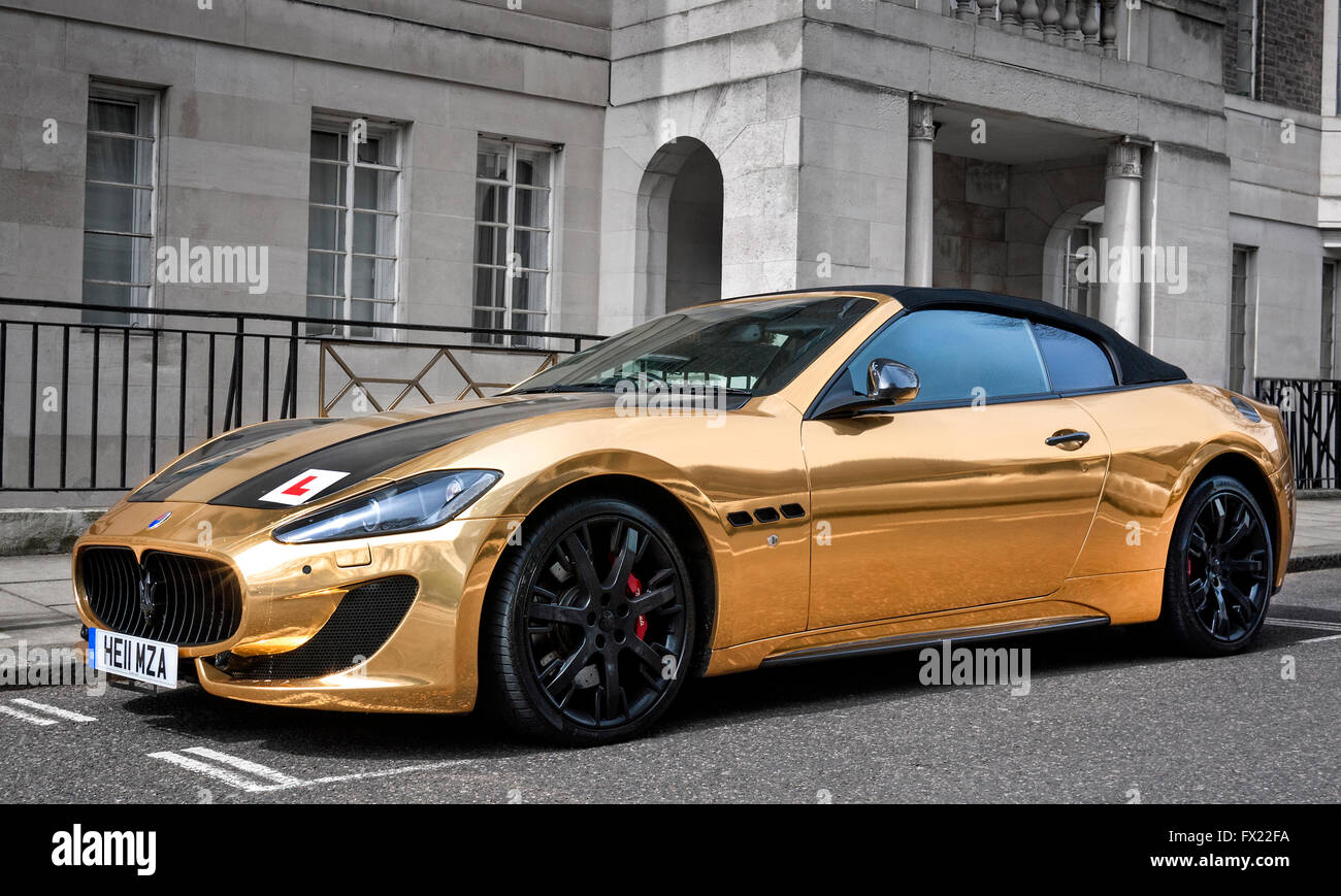 Gold plated Maserati Grand Turismo Convertible MC with a learner drivers L plate attached,parked in a street in Mayfair London Stock Photo