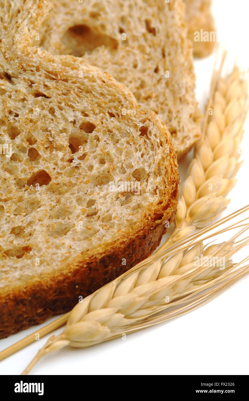 Whole wheat bread slices on white background Stock Photo - Alamy