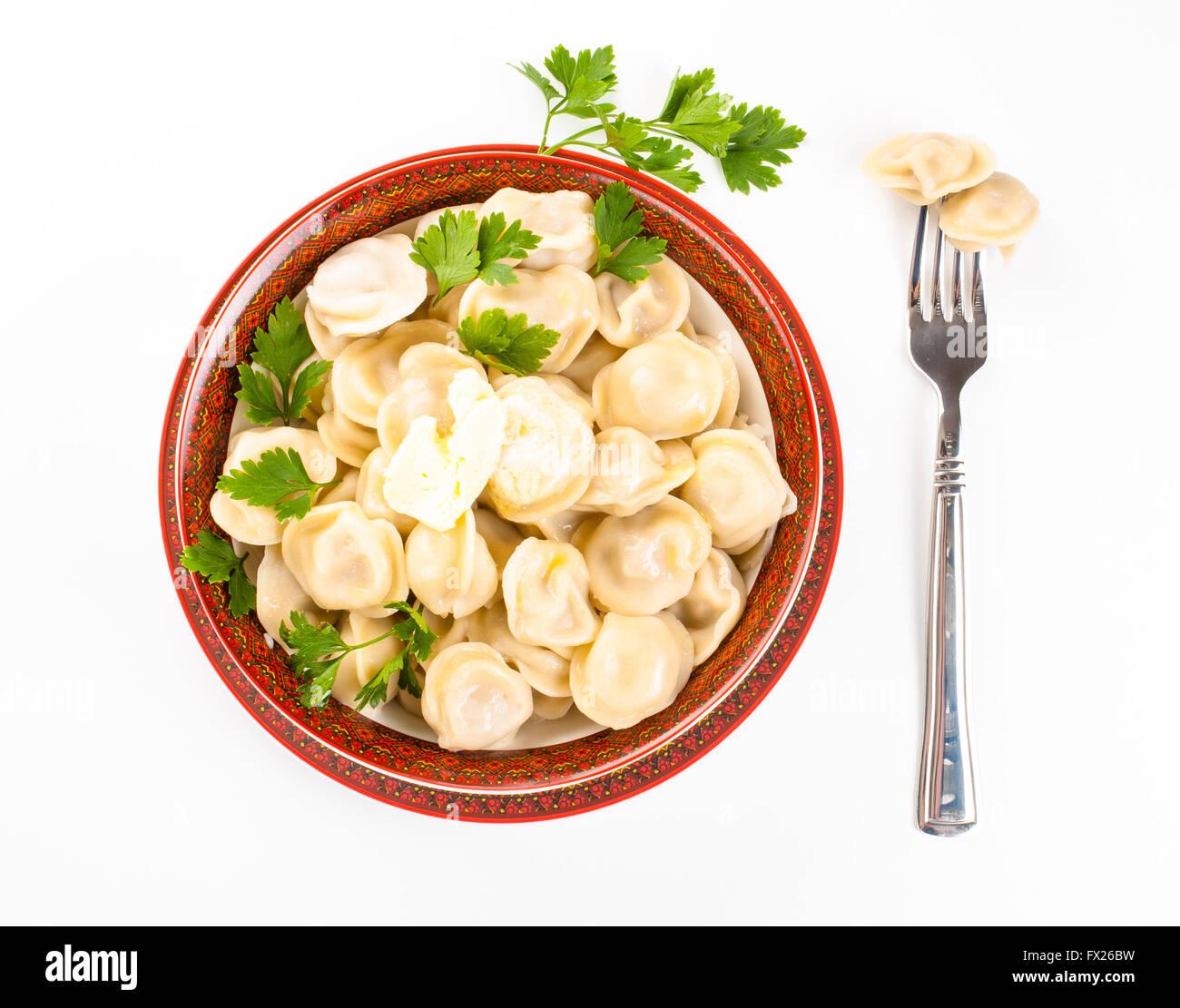 dumplings in a plate with a parsley and butter Stock Photo