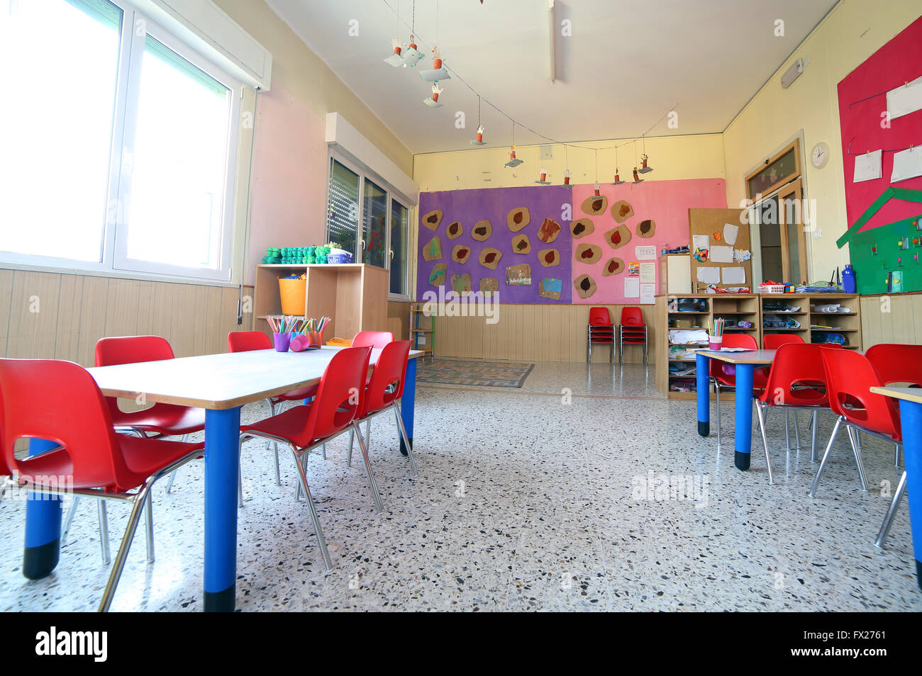 inside of the kindergarten classroom with drawings on the walls Stock Photo
