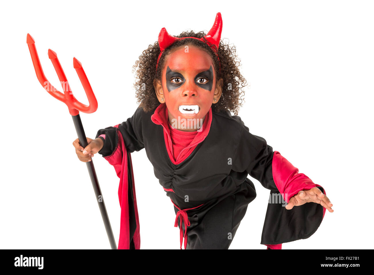 Girl with facepaint and devil Halloween costume isolated in white