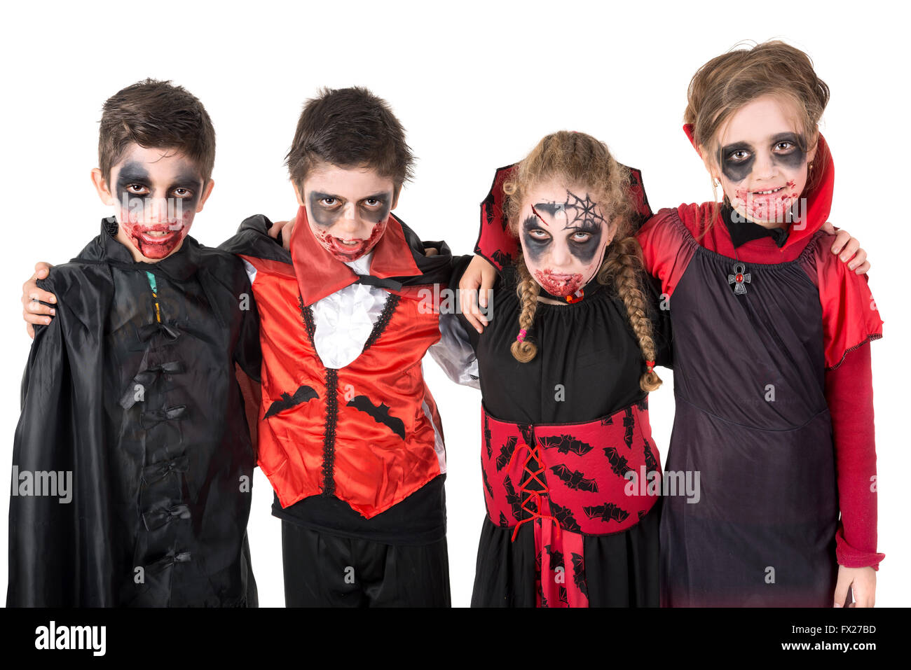 Group of kids with face-paint and Halloween vampire costumes Stock Photo -  Alamy