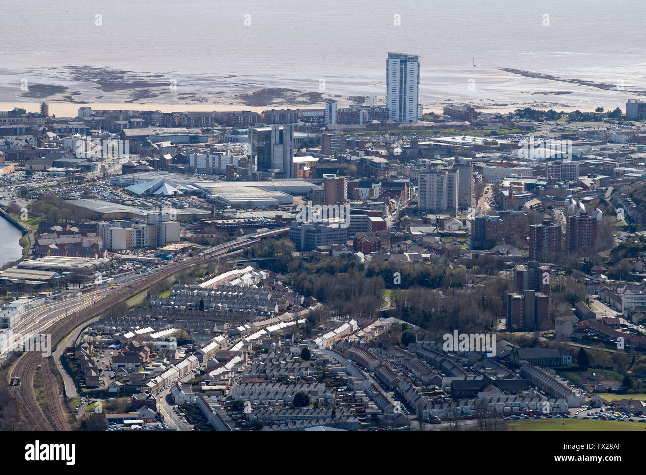 Aerial view of Swansea city centre showing the The Tower at Meridian Quay - the tallest building in Wales, the railway line and Stock Photo