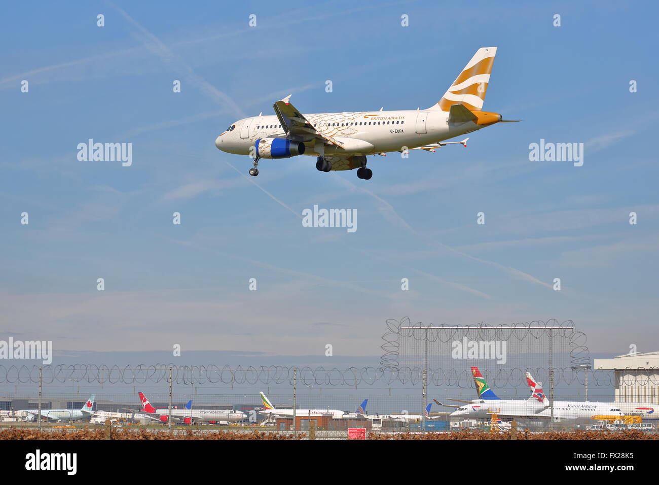 British Airways Airbus A319 G-EUPA landing at London Heathrow Airport, UK Stock Photo