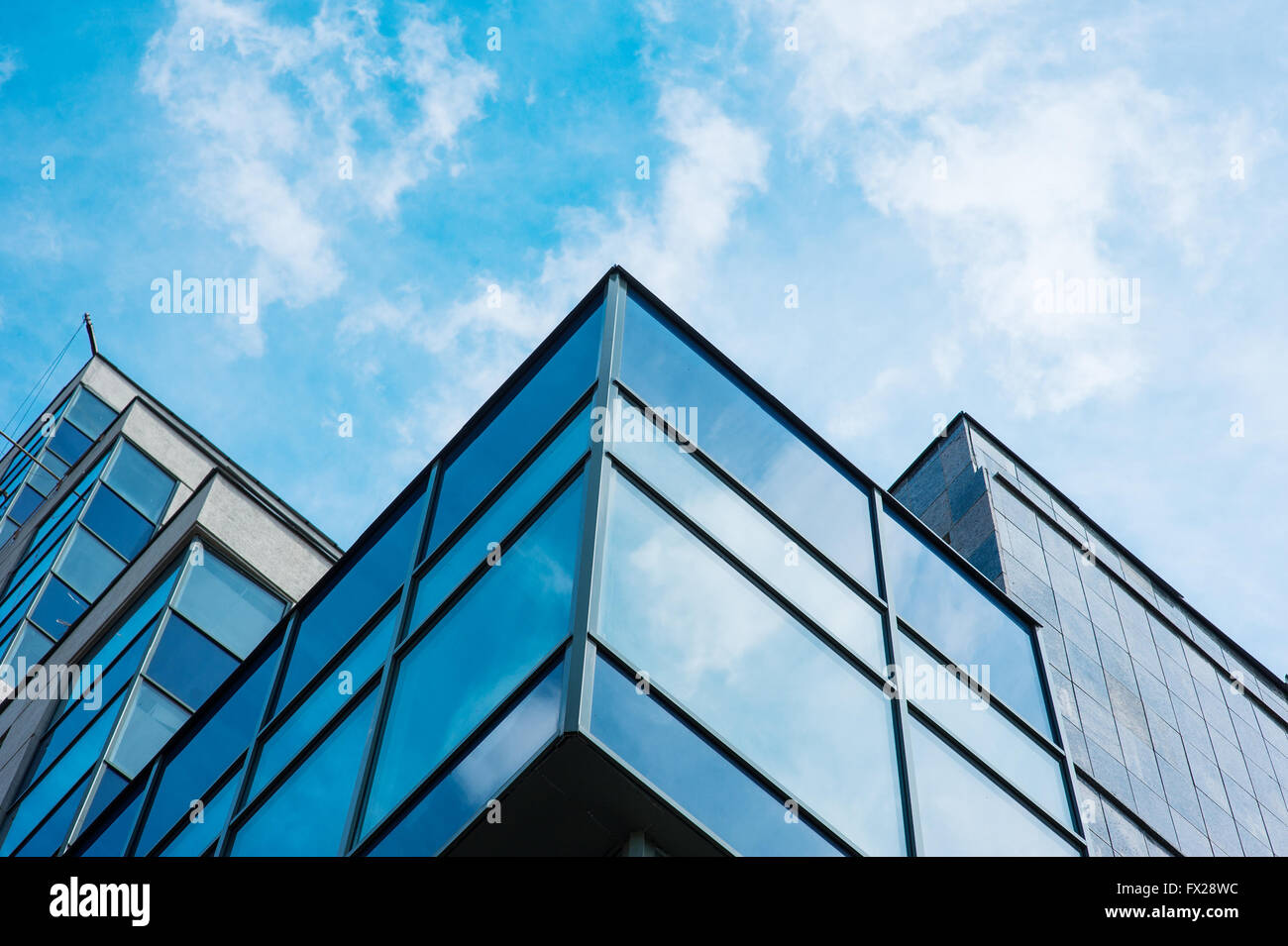 Panoramic wide angle view to steel blue background of glass high rise building skyscrapers in modern futuristic downtown Stock Photo