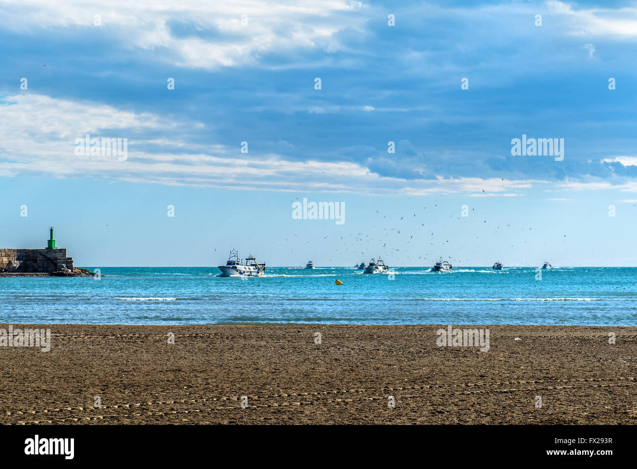 FIshing boats returning from fishing to the port of Peniscola Stock Photo