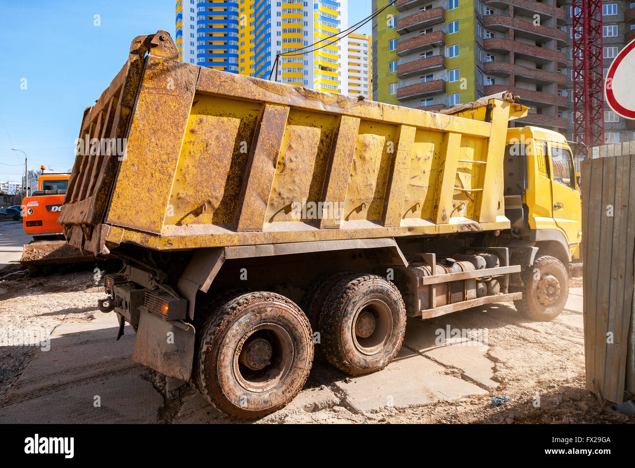 Heavy truck drives to the construction site Stock Photo